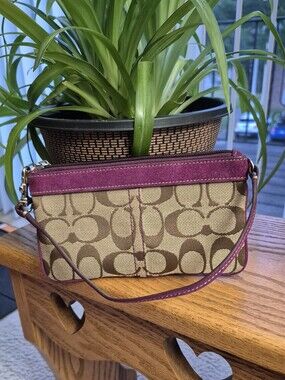 Coach Signature Canvas Wristlet with Purple Trim. GOOD EXTERIOR. INTERIER FLAWS